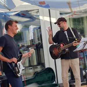 A photo of two musicians at Dive Bär's Open Mic Night