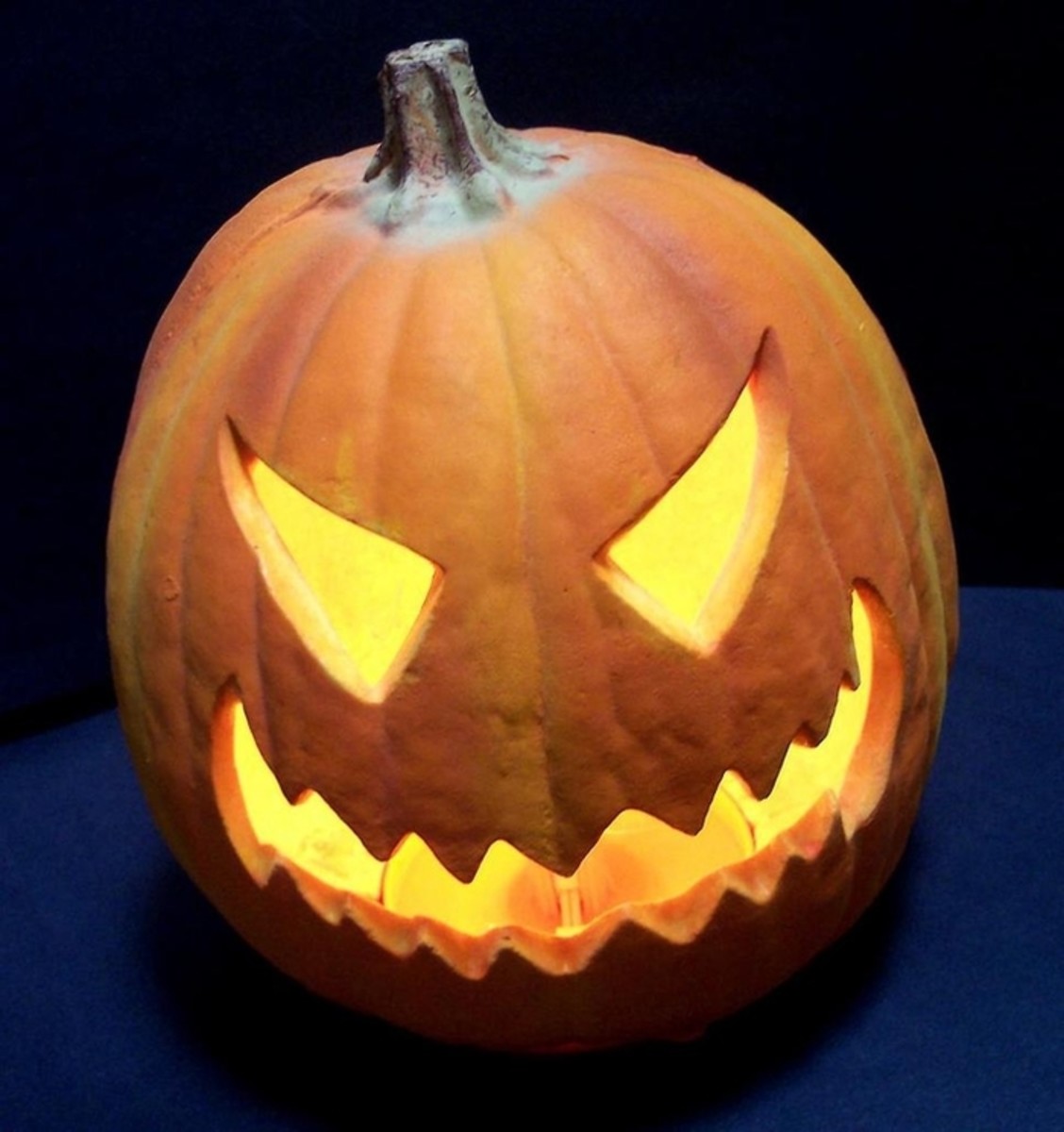 Photo of a scary jack-o-lantern on a dark background